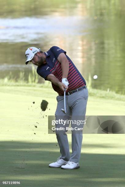 Marc Leishman of Australia plays a shot on the 13th hole during the second round of the Quicken Loans National at TPC Potomac on June 29, 2018 in...