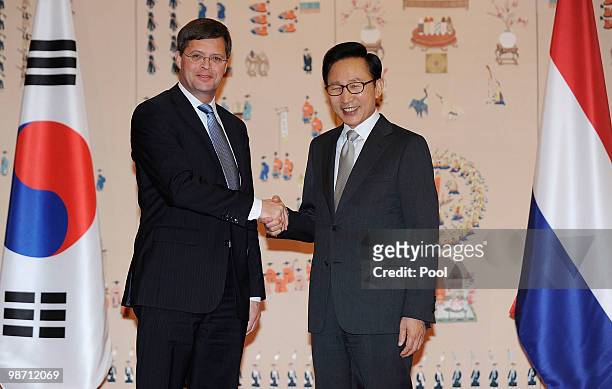 Netherands Prime Minister Jan Peter Balkenende shakes hands with South Korean President Lee Myung-Bak prior to the summit meeting at presidential...