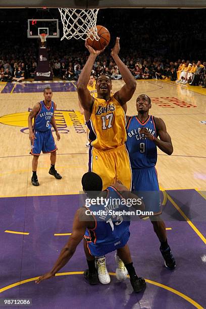 Andrew Bynum of the Los Angeles Lakers goes up for a shot against James Harden of the Oklahoma City Thunder in the second half during Game Five of...