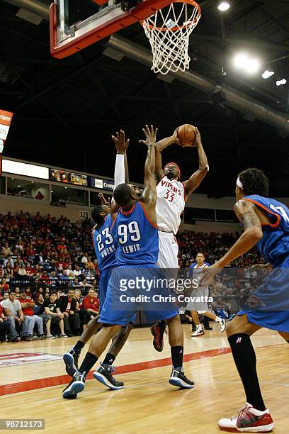 Michael Harris of the Rio Grande Valley Vipers shoots over Larry Owens and Marcus Lewis of the Tulsa 66ers in Game Two of the 2010 NBA D-League...
