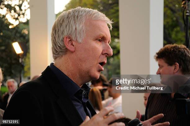 Director James Cameron gets interviewed on the blue carpet at "Is Pandora Possible?", a scientific discussion panel regarding the science and...
