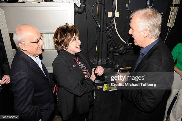 Director James Cameron chats backstage with entertainment journalist Jeanne Wolf and Wolf's husband Peter at "Is Pandora Possible?", a scientific...