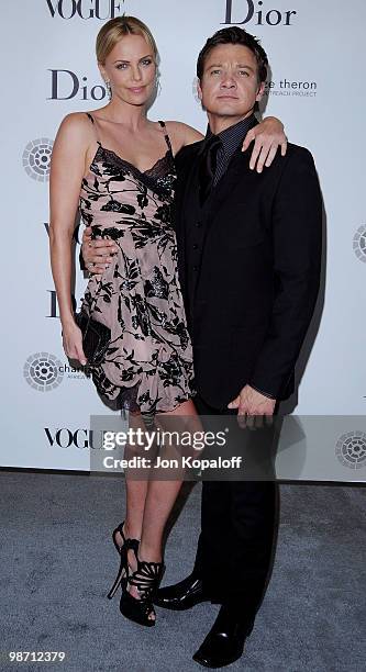 Actress Charlize Theron and actor Jeremy Renner pose at Dior & Vogue Celebrate The Charlize Theron Africa Outreach Project at Soho House on April 27,...