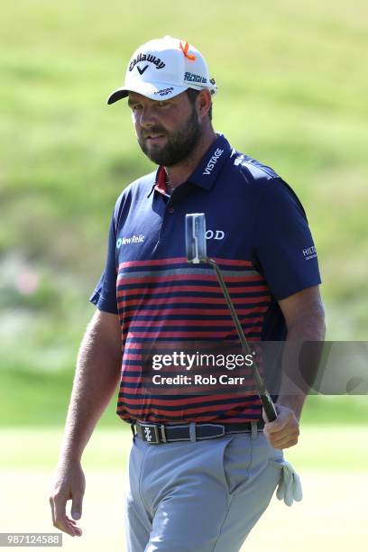 Marc Leishman of Australia reacts after a putt on the 15th green during the second round of the Quicken Loans National at TPC Potomac on June 29,...