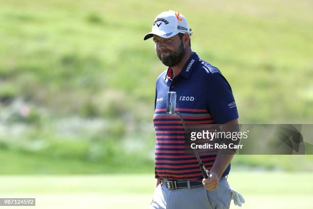Marc Leishman of Australia reacts after a putt on the 15th green during the second round of the Quicken Loans National at TPC Potomac on June 29,...