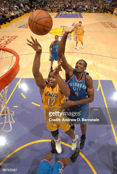 Andrew Bynum of the Los Angeles Lakers puts up a shot against Serge Ibaka of the Oklahoma City Thunder in Game Five of the Western Conference...