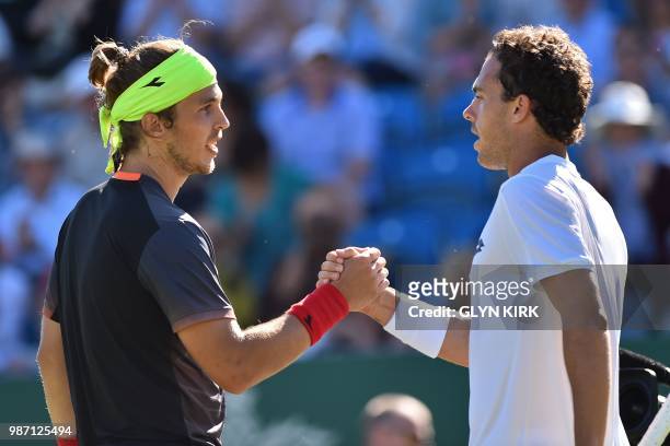 Slovakia's Lukas Lacko shakes hands with Italy's Marco Cecchinato after their men's singles semi-final match at the ATP Nature Valley International...