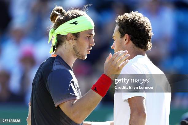 Lukas Lacko of Slovakia talks to Marco Cecchinato of Italy after winning the semi-final match on day eight of the Nature Valley International at...