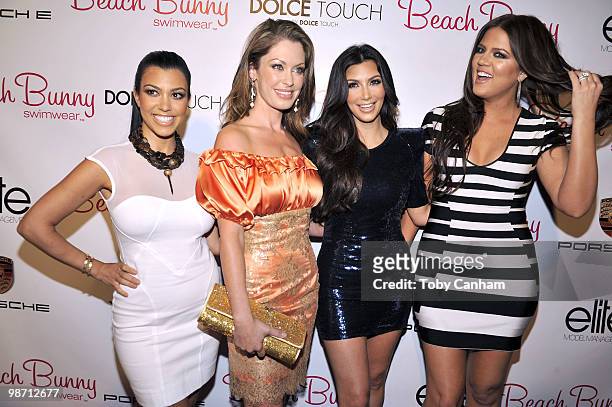 Kourtney Kardashian, Angela Chittenden, Kim Kardashian and Khloe Kardashian pose for a picture at the Beach Bunny Swimwear's grand opening party on...