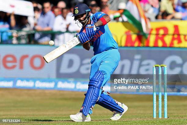 India's Lokesh Rahul hits a six to bring up his half century during the Twenty20 International cricket match between Ireland and India at Malahide...