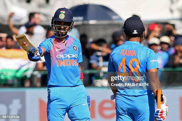 India's Lokesh Rahul celebrates reaching his half century during the Twenty20 International cricket match between Ireland and India at Malahide...