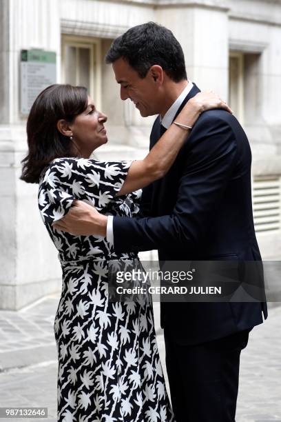 Mayor of Paris Anne Hidalgo welcomes Spain's Prime Minister Pedro Sanchez at Hotel de Ville in Paris on June 29, 2018.