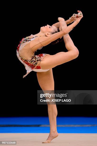 Spanish Sara Llana competes during the women's rhythmic gymnastics individual qualification at the XVIII Mediterranean Games in Reus near to...