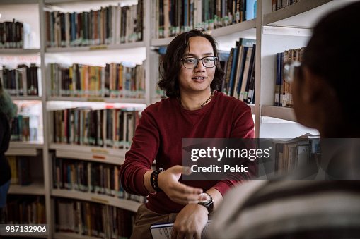 Knowing One Another Students Getting To Know One Another At Library High-Res Stock Photo ...