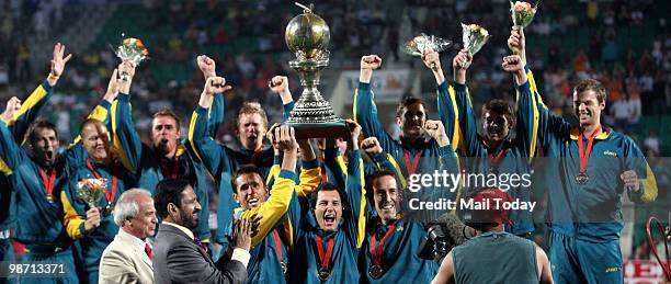 The Australian team pose with the trophy during the International Hockey Federation World Cup 2010 field hockey match in New Delhi on Saturday, March...