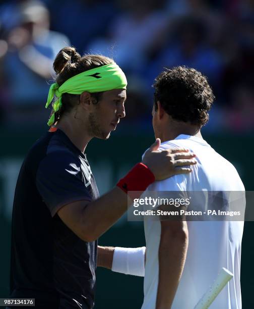 Slovakia's Lukas Lacko shakes hands with Italy's Marco Cecchinato after the match during day six of the Nature Valley International at Devonshire...