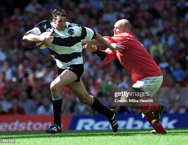 Ian Jones of the Barbarians fends of Craig Quinnell of Wales during the match between the Barbarians and Wales at the Millennium Stadium. Digital...