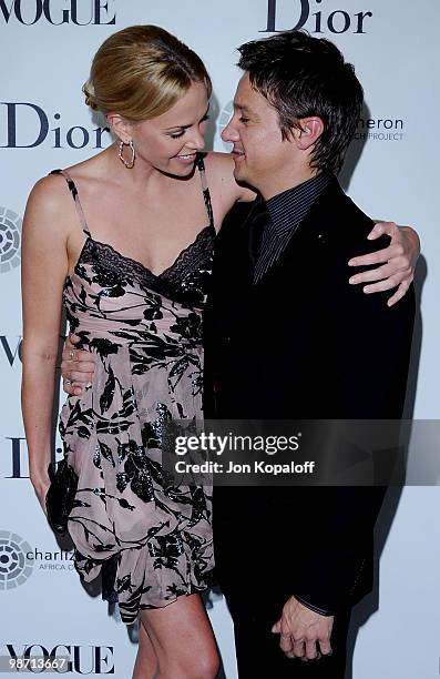 Actress Charlize Theron and actor Jeremy Renner pose at Dior & Vogue Celebrate The Charlize Theron Africa Outreach Project at Soho House on April 27,...