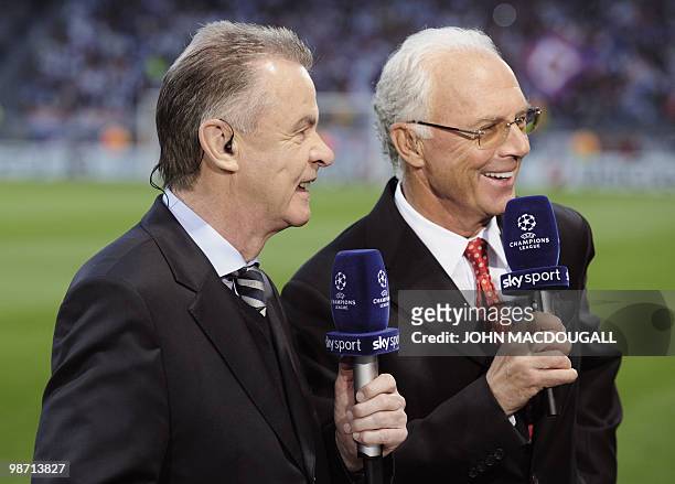 Coach of the Swiss football team Ottmar Hitzfeld of Germany and German football legend Franz Beckenbauer share their comments on a live broadcast...