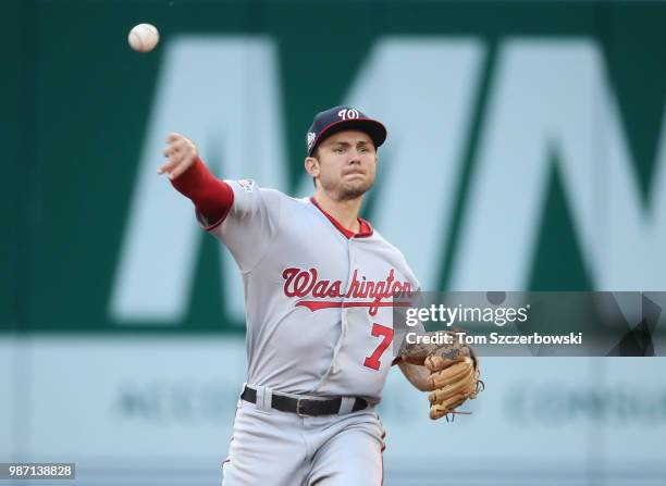 Trea Turner of the Washington Nationals makes the play and throws out the baserunner in the second inning during MLB game action against the Toronto...