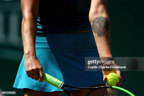 The tiger tattoo of Aryna Sabalenka of Belarus on show during her womens singles semi final match against Agnieszka Radwankska of Poland during Day...