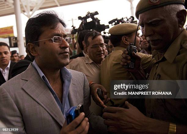 Suspended Indian Premier League Chairman Lalit Modi arrives at Indira Gandhi International Airport's domestic terminal in New Delhi on April 28,...