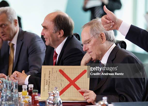 German Finance Minister Wolfgang Schaeuble attends the weekly German government cabinet meeting at the Chancellery on April 28, 2010 in Berlin,...