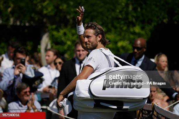 Lucas Pouille of France waves to the crowd after beating Rafael Nadal of Spain during day four of the Aspall Classic at the Hurlingham Club, London.