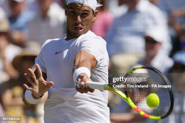 Rafael Nadal of Spain plays a return to Lucas Pouille of France during day four of the Aspall Classic at the Hurlingham Club, London.