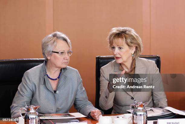 German Education Minister Annette Schavan and State Secretary Gudrun Kopp attend the weekly German government cabinet meeting at the Chancellery on...