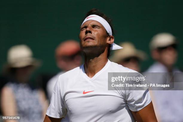 Rafael Nadal of Spain looks dejected during his match with Lucas Pouille of France during day four of the Aspall Classic at the Hurlingham Club,...