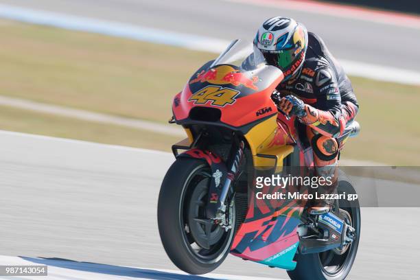 Pol Espargaro of Spain and Red Bull KTM Factory Racing lifts the front wheel during the MotoGP Netherlands - Free Practice on June 29, 2018 in Assen,...