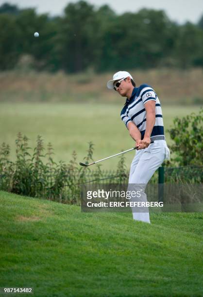 Chinese golfer Li Hao-Tong competes in the second round of the HNA Open de France, as part of the European Tour 2018, at the...