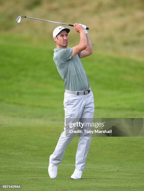 Ross Fisher of England plays his second shot on the 17th fairway during Day Two of the HNA Open de France at Le Golf National on June 29, 2018 in...