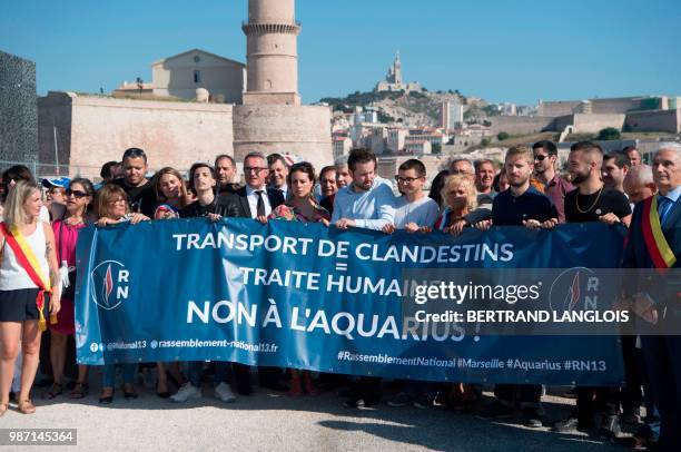 Rassemblement National far-right members take part in a rally against the Aquarius rescue vessel, chartered by French NGO SOS-Mediterranee and...