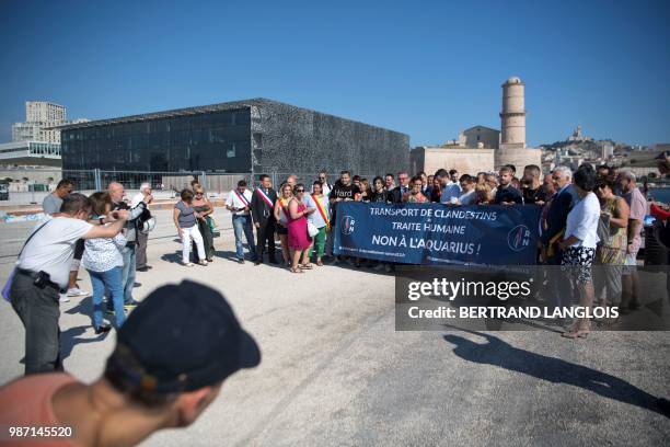 Rassemblement National far-right members take part in a rally against the Aquarius rescue vessel, chartered by French NGO SOS-Mediterranee and...