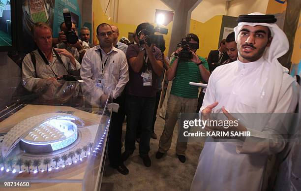 Sheikh Mohammed bin Hamad al-Thani presents a model of one of Doha's stadiums as the Gulf emirate bids for hosting the FIFA World Cup in 2022 during...