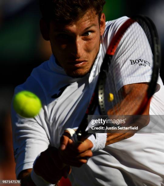 Pablo Carreno Busta of Spain plays a backhand against Karen Khachanov of Russia during the Aspall Tennis Classic at Hurlingham on June 29, 2018 in...