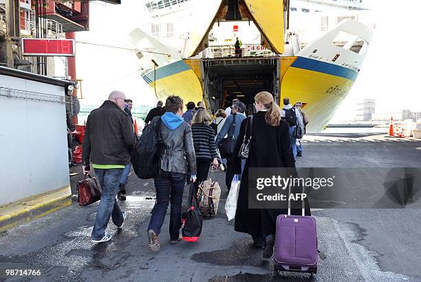 People wait to board a ferry bound for England on April 20, 2010 at Le Havre harbor, northwestern France. Hundreds of exhausted British tourists...