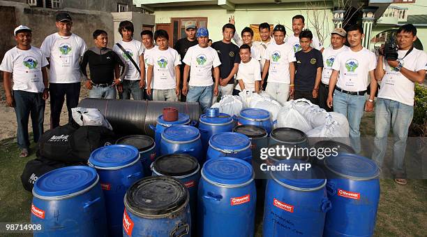 Nepal-Everest-Environment-Pollution by Subel Bhandari Nepalese Sherpa climbers pose after preparing their equipment prior to an Everest clean-up...