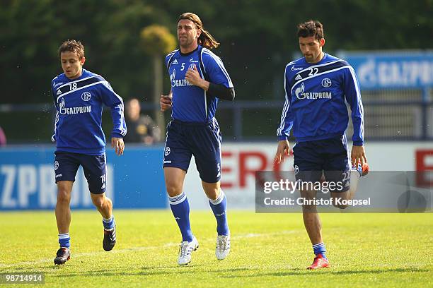 Rafinha, Marcelo Bordon and Kevin Kuranyi of Schalke attend the training session of FC Schalke at the training ground on April 28, 2010 in...