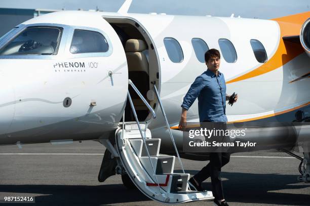 Ki Sung-yueng arrives at the Newcastle Airport before being transported to The Newcastle United Training Centre on June 29 in Newcastle upon Tyne,...