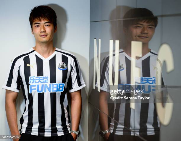 Ki Sung-yueng poses for photographs after signing for Newcastle United at St.James' Park on June 29 in Newcastle upon Tyne, England.