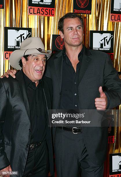 Music commentator Molly Meldrum and AFL player Wayne Carey arrives at the "MTV Classic: The Launch" music event at the Palace Theatre on April 28,...