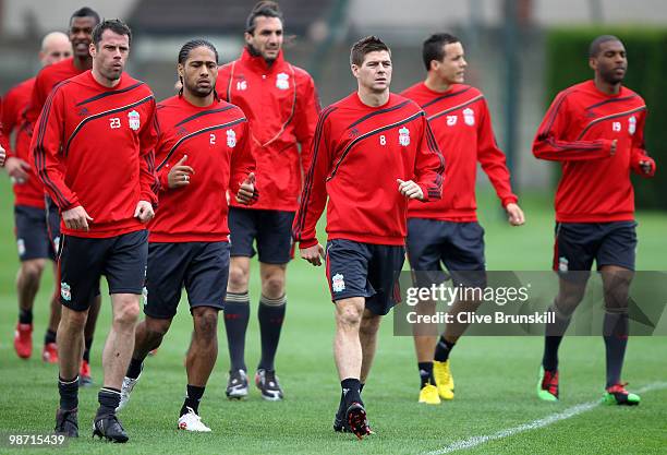 Steven Gerrard of Liverpool and team mate Jaime Carragher lead the pack on a light nwarm up jog during a training session prior to the UEFA Europa...