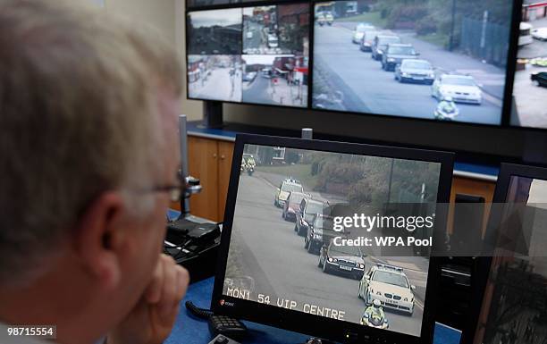 Police officers monitor the Prime Minister's convoy on CCTV cameras as they approach the Oldham event control room, one of the major CCTV hubs in the...