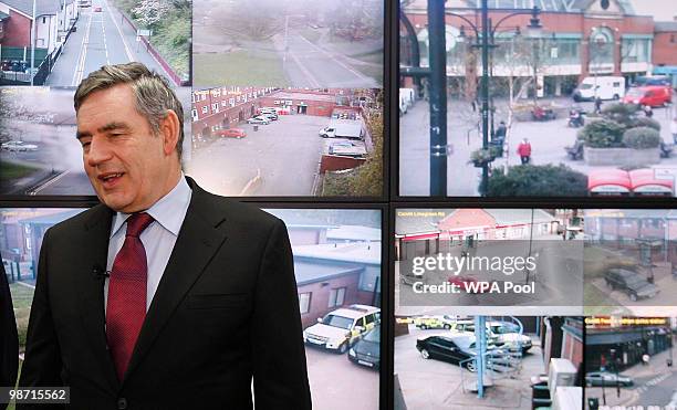 Prime Minister Gordon Brown talks to Police officers as they monitor screens from CCTV cameras in the Oldham event control room, one of the major...