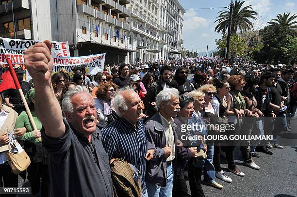 Demonstrators march in central Athens on April 22, 2010. Greek civil servants staged on Thursday the fourth 24-hour strike this year against a tough...