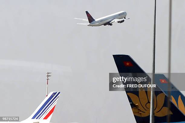 An airplane takes off at Roissy-Charles-de-Gaulle airport on April 21, 2010 in Roissy-en-France, northern Paris. All long-haul passenger services to...