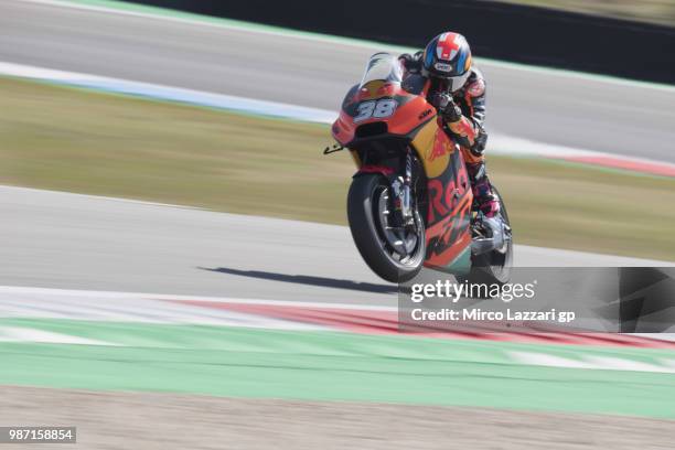 Bradley Smith of Great Britain and Red Bull KTM Factory Racing lifts the front wheel during the MotoGP Netherlands - Free Practice on June 29, 2018...